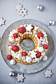 Christmas wreath cake decorated with meringue dots and biscuits