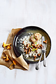 Monkfish with cream and rice with chanterelles