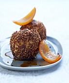 Baked apple with a crust of cinnamon, dried fruit and candied orange