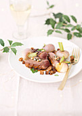 Duck breast with turnips, capers and pine nuts