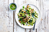 Mushroom and spinach dish with pearl pasta and pesto sauce