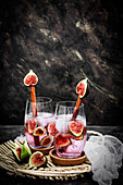 Mineral water with fresh figs and ice cubes