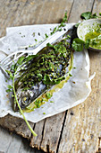 Perch with watercress in parchment paper