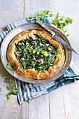 Watercress pie with mushrooms and ricotta