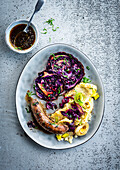 Grilled veal sausage with roasted red cabbage and leek puree