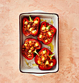 Red bell peppers stuffed with chicken, tomato sauce and mozzarella