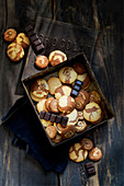 Marbled shortbread biscuits coated in chocolate in a tin box