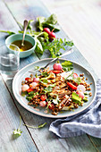 Spelt salad with grilled chicken breast and glazed radishes