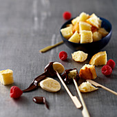 Chocolate fondue with fruit and brioche