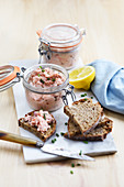 Salmon rillettes in glass jars with bread