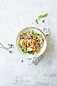 Salad with pearl couscous, prawns and peas