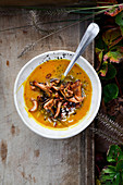 Autumn miso pumpkin soup with rice and mushrooms