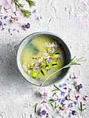 Melon soup with coconut water, rosemary and edible flowers