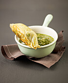 Cheese in brick pastry with coriander pesto