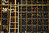 Racks of bottles of vintage Armagnac