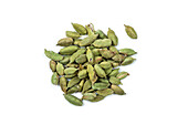 Green cardamom seeds on a white background