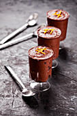 Small glasses of homemade chocolate and orange mousse