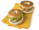 Shrimp bagel sandwich and smoked salmon and cream cheese bagel sandwich