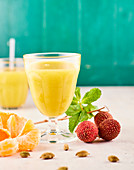 Juice with infusion of cardamom, lychees and clementines
