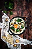 Egg casserole with mushrooms, spinach and goat's cheese