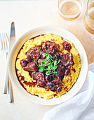 Beef with cherries and polenta
