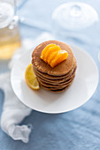 Buckwheat pancake stack with citrus fruit
