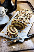 Coffee and almond rolled sponge cake