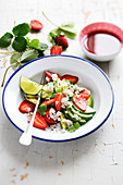 Strawberry fruit salad with avocado and flaked crab meat
