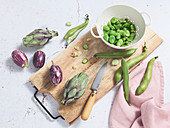 Podding fresh broad beans,small artichokes and mini aubergines