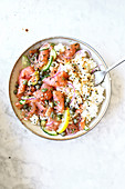 Rice salad with salmon carpaccio