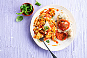 Chicken breast with mozzarella and tomato and tagliatelle with mushrooms