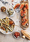 Bruchettas with tomato appetizers and sesame mini puff pastry