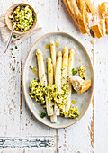 White asparagus Flemish style and scrambled eggs with herbs