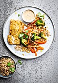 Fried white fish and rice wok with vegetables
