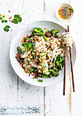 Asian noodle salad with broccoli and cashew nuts