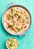 Salmon au gratin with leek and cheese sauce served with mashed potatoes