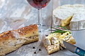 Camembert,bread and glass of red wine