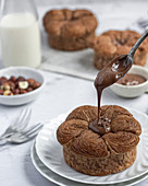 Pour chocolate hazelnut spread on a puff pastry brioche.