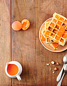 Waffles with hazelnuts, almonds and apricot coulis