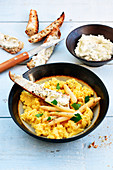 Scrambled eggs with asparagus and bread soldiers