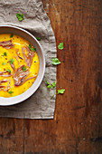 Cream of squash soup with confit duck