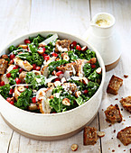 Caesar salad revisited with kale cabbage,chicken,hazelnuts and pomegranate