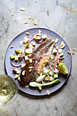 Trout with almonds and celery branch