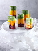 Three colored iced lollipops