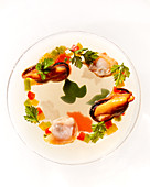 Transparent plate of seafood and vegetables