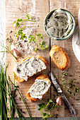 Herb cream cheese spread on toasts