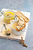 Creamy chicken broth infused with foie gras and spices, toasted slice of bread with foie gras