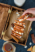 Sandwich cookies with marshmallow, milk chocolate and caramel