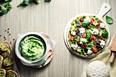 Broccoli hummus and green broccoli pizza with merguez
