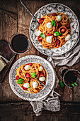 Spaghetti with tomato and mozzarella plates
